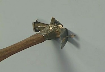 putting a hole in the wall while trying to remove a nail with a hammer