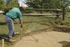 leveling the concrete paver walkway foundation with sand