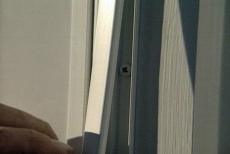 snapping trim over screws as we install a storm door