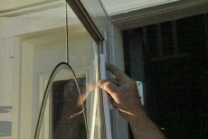inserting strips to secure the glass as we install a storm door