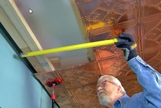 Installing copper ceiling edge tiles