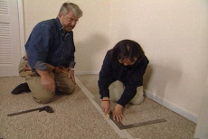 scoring the closet carpet with a utility knife