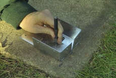 inserting an expansion anchor into concrete