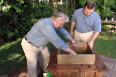 setting the pressure-treated plywood liner in the planter