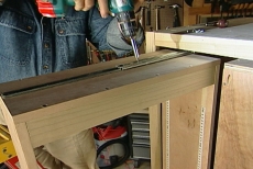 Attaching glides in pantry cabinet