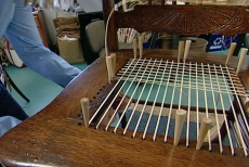 reweaving the antique chair's cane seat