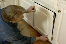 remounting the cabinet doors over the pull-out shelves