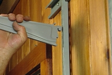 inserting shelf supports in the standards