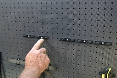 pushing the screw head to lock the tool holders in place