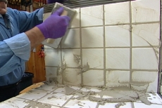 Using a float to push grout into the joints