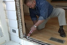 Applying silicone sealant to the threshold