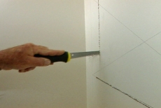 Cutting an access opening with a wallboard saw