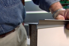 positioning a Slatwall shelf bracket