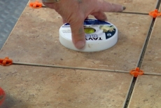 Using a tile puck to check the tile height