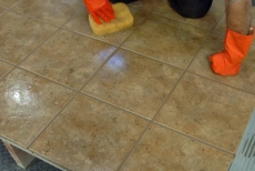Cleaning the tile with long strokes