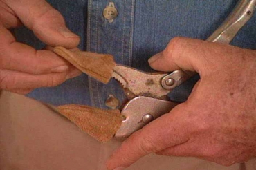 covering plier jaws with fingers from a glove