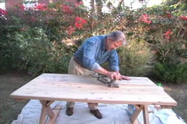 sanding an outdoor table