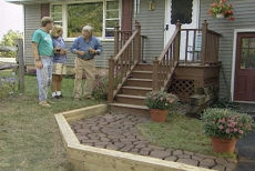 discussing finishing techniques for the concrete paver walkway