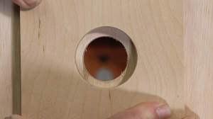 Hole in wood drilled with hole saw