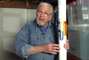 Man talking near a radon vent
