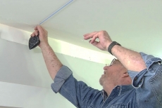 Man marking ceiling joists