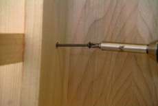 securing the shelf with screws