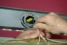 removing wire nuts on the light fixture wiring