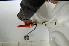 You cannot remove a toilet before loosening the nut