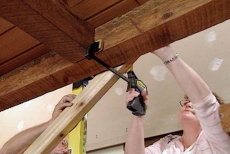 clamping the railing to the ceiling beam