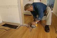 resurfacing the damaged hardwood flooring