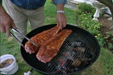 placing ribs on grill
