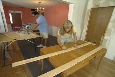 working on a wainscoting assembly line
