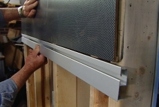 adding the bottom track to hold a wall panel