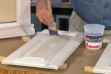 Using long strokes to apply the top coat