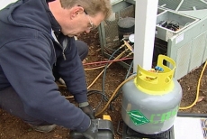 bleeding air conditioning refrigerant into a tank for proper disposal
