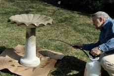 applying multi-surface waterproofer with a garden sprayer