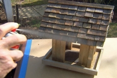 coating a cedar bird feeder with multi-surface waterproofer