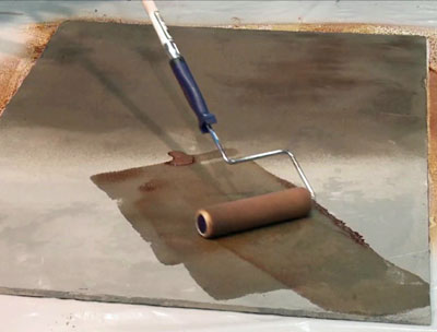 Applying stain with paint roller 