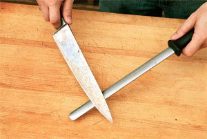Images: Knife being manually sharpened using a knife steel 
