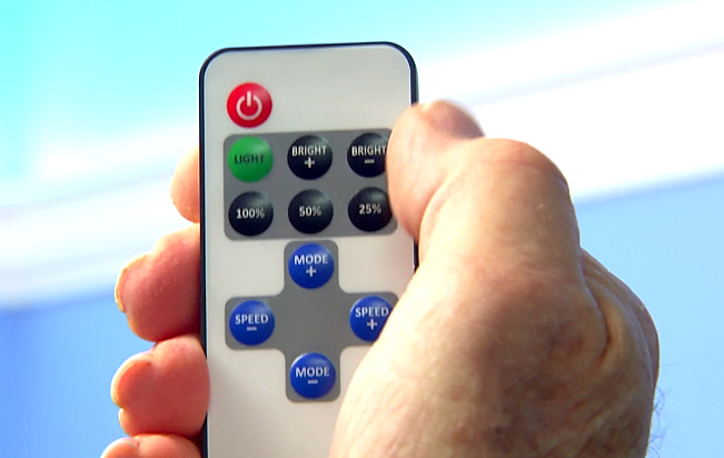 man holding remote control