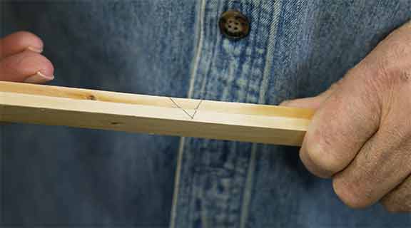 Man made index mark on wooden stick