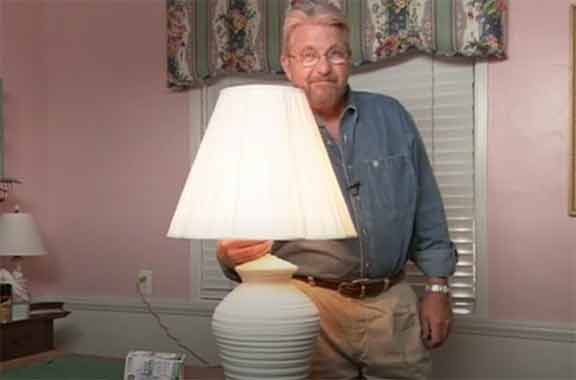 Man turning on lamp