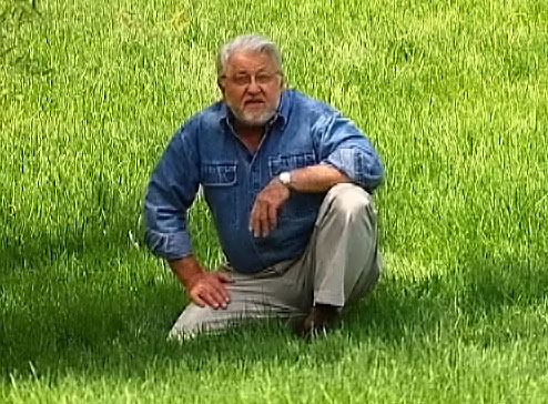 Ron Hazelton sitting in grass