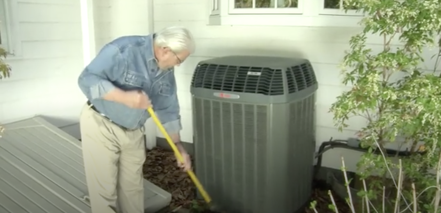 Man cleaning out ac unit